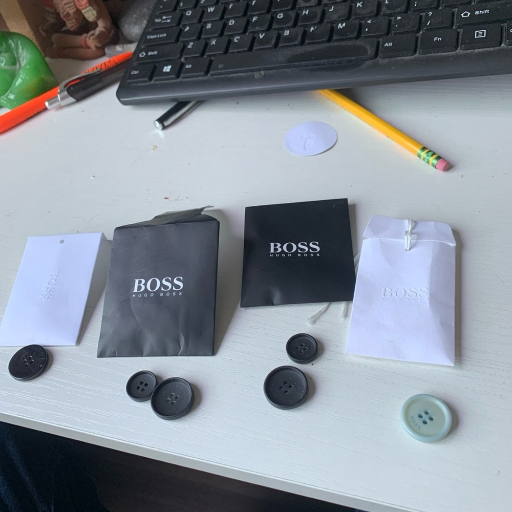 HUGO Black Button with Embossed Packaging
